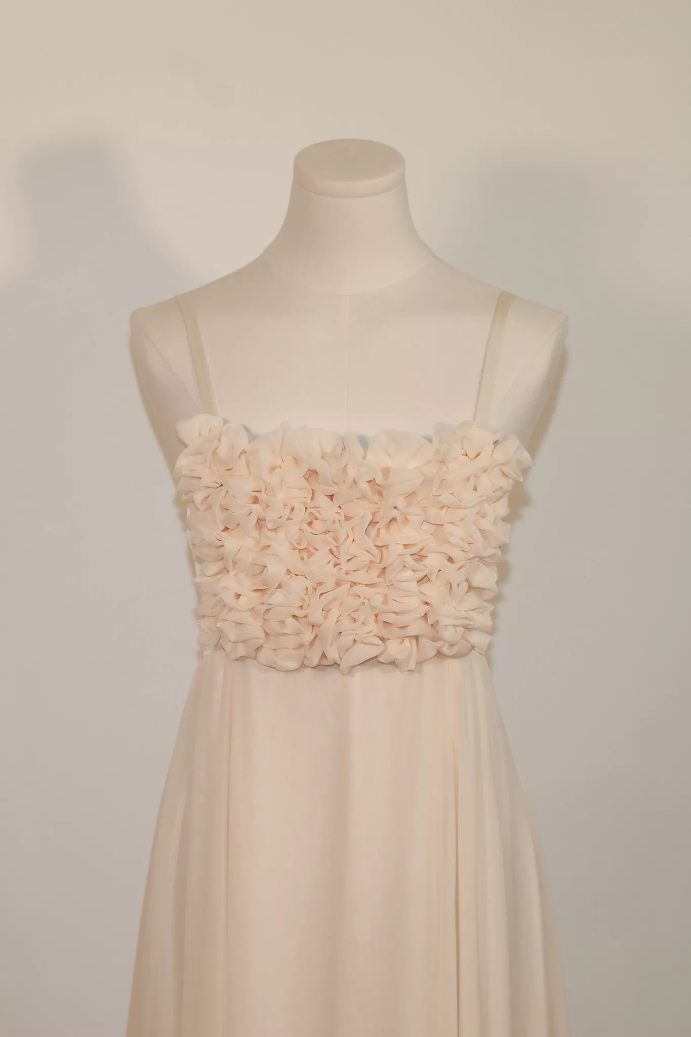 Hand-worked rosette bodice of the Aria silk chiffon wedding dress